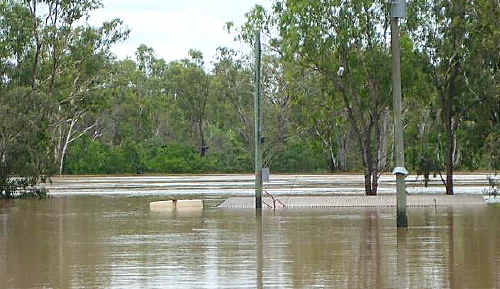 FLOOD: Bedford Weir looks peaceful upstream, but is raging over the spillway. cont FLOOD: Bedford Weir looks peaceful upstream, but is raging over the spillway. cont